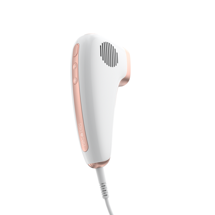 White and rose gold hair removal device on a white background