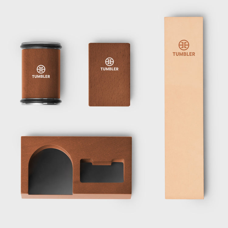 Brown tumbler with packaging on a white background