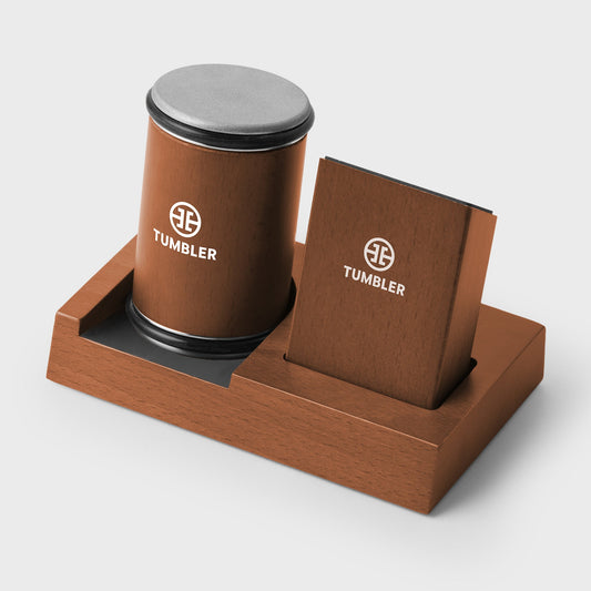 Orange Tumbler packaging box with branded items on a light gray background