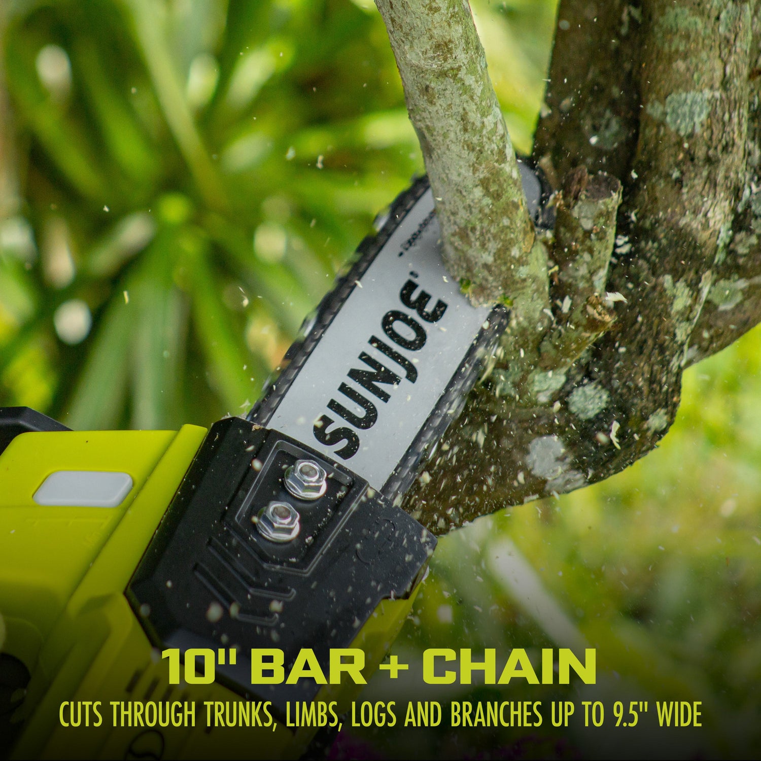 Sun Joe chainsaw cutting through a branch with a blurred green background
