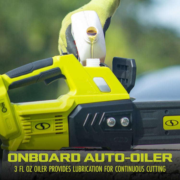 Yellow chainsaw with onboard auto-oiler mechanism, gloved hand adding oil, blurred green background.