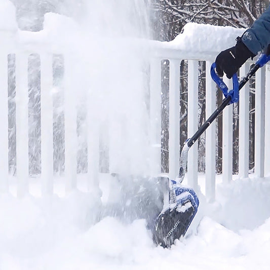 Blue and black snow blower with accessories on a white background