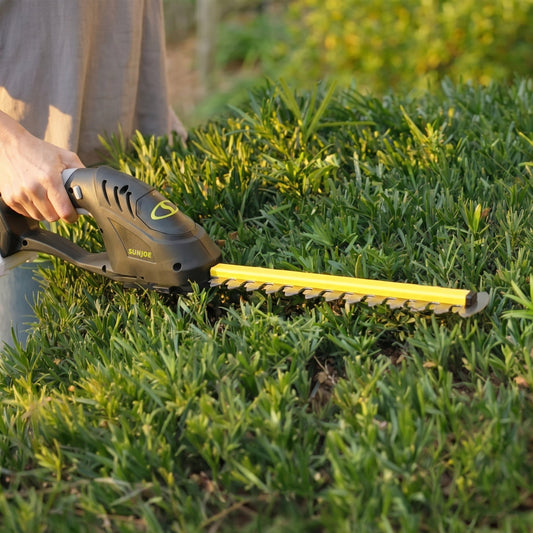 Sungoo hedge trimmer with close-up of use on grass