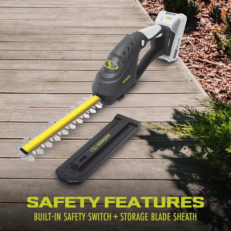 Sun Joe hedge trimmer on a wooden deck with safety features highlighted.