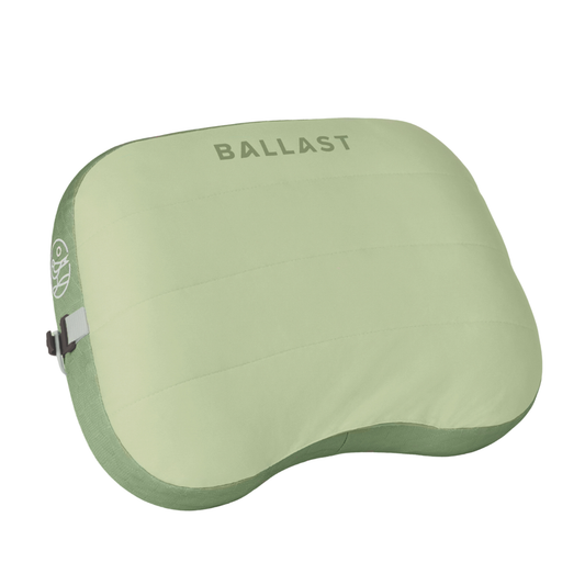 Green neck pillow with 'BALLAST' branding on a white background