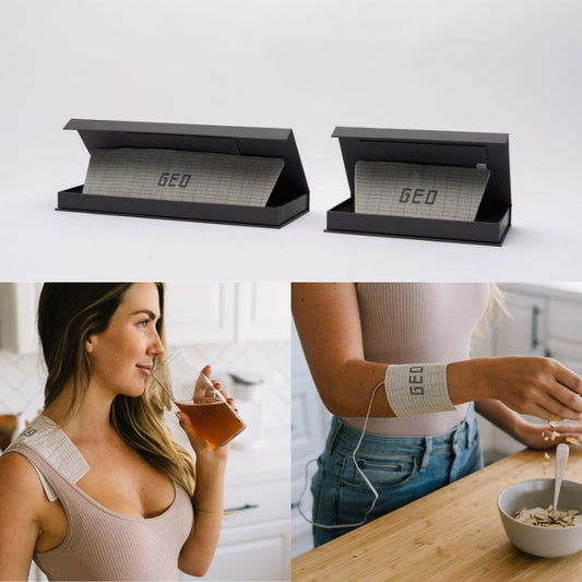 Two black electronic devices, one large and one small, shown on a white surface. Below, two people wear the devices on their arms.