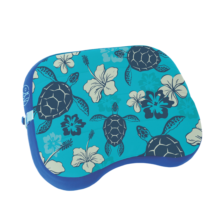 Blue pillow with turtle and floral pattern on a white background