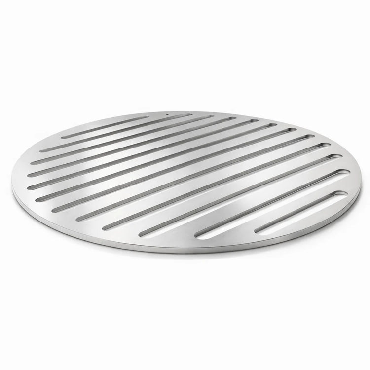 Round metal drain cover with slotted design on a white background