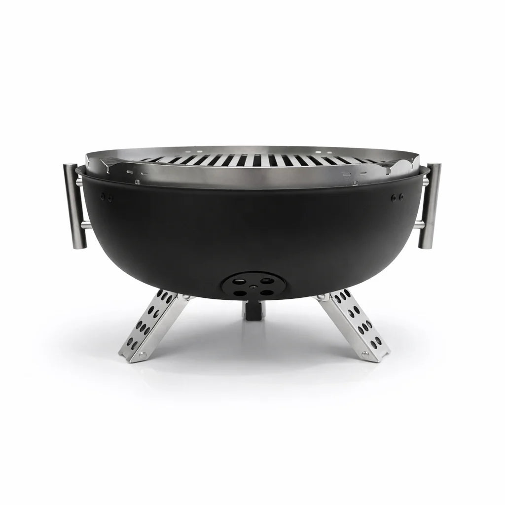 Black portable grill with metal legs on a white background