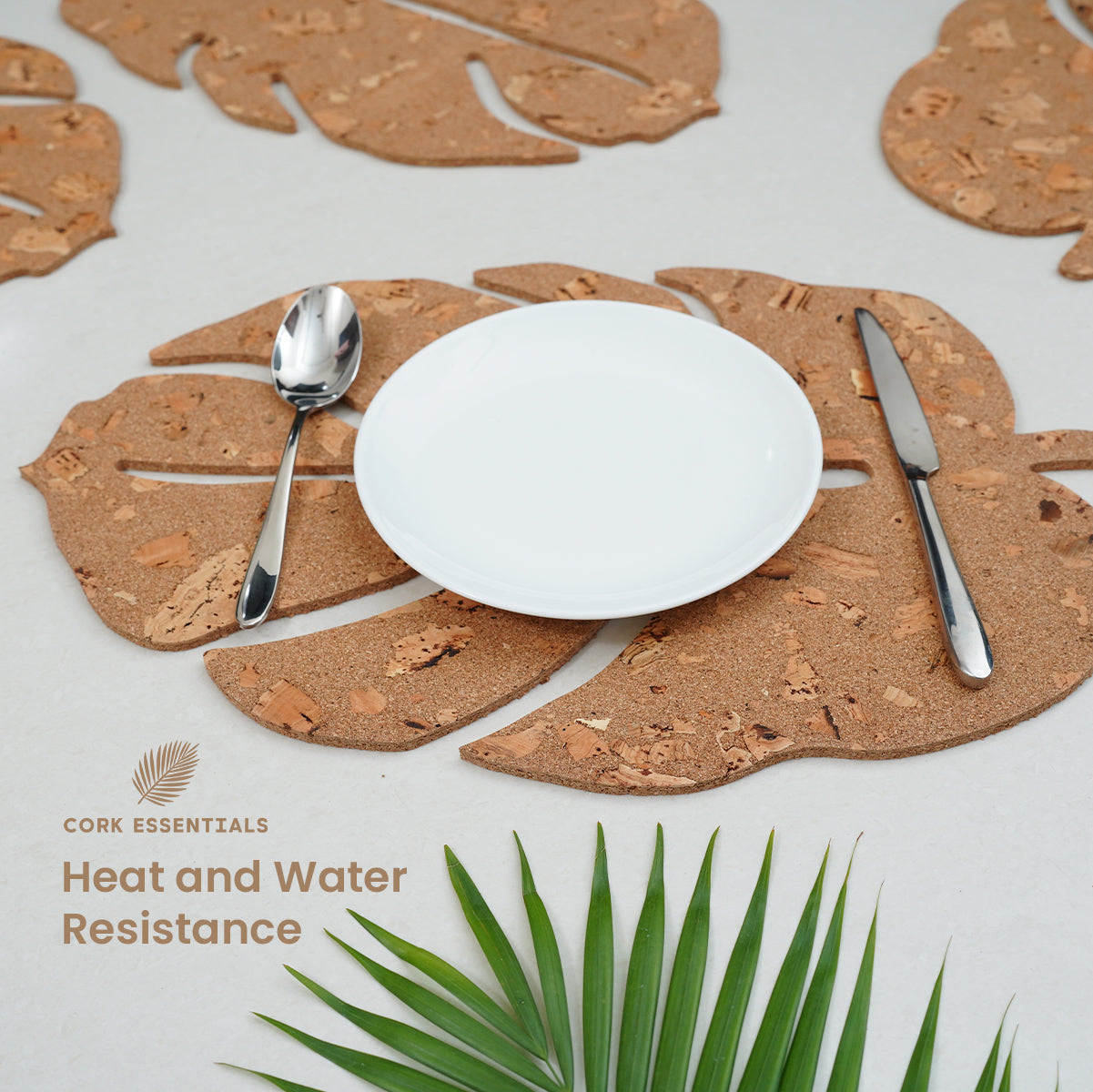 Cork placemats with a plate, spoon, and knife on a light background with 'Cork Essentials' branding.