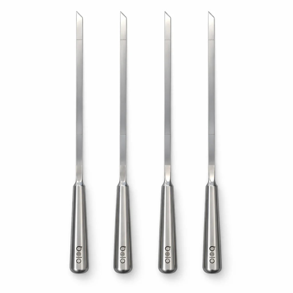 Set of four metal knives with handles on a white background