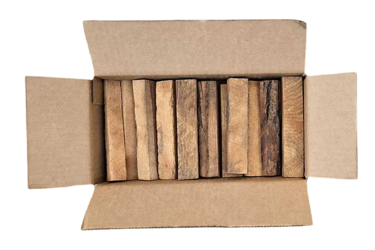 Cardboard box with wooden planks inside on a white background