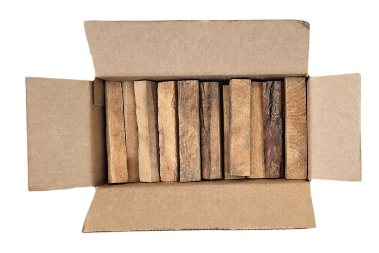 Cardboard box with wooden planks inside on a white background