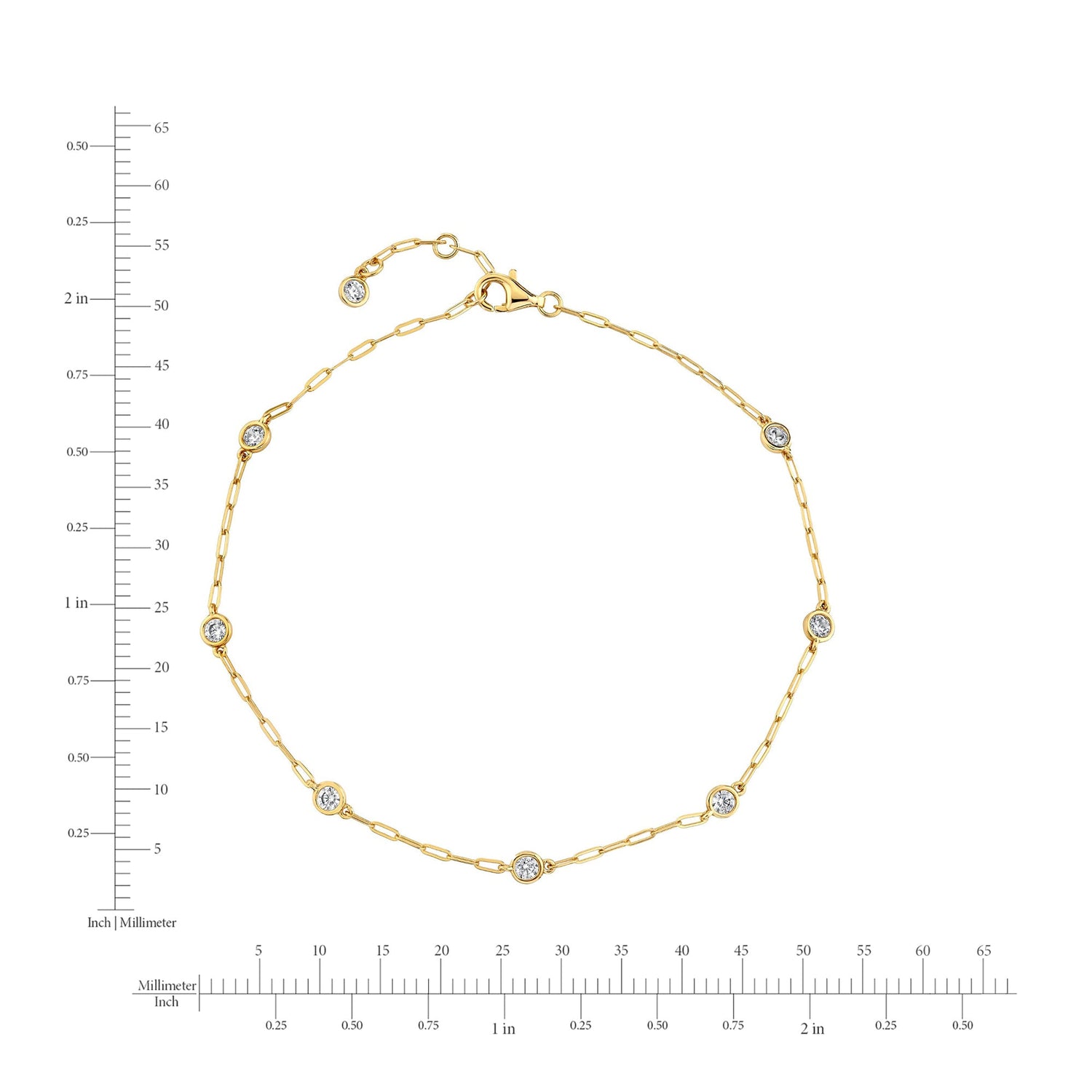 Gold bracelet with diamond accents on a white background with measurement scale