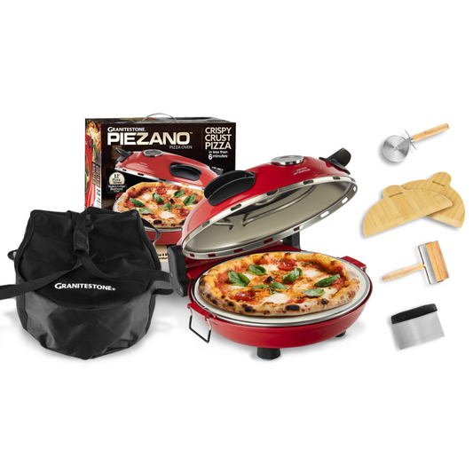 A red countertop pizza oven with a 12-inch pizza on it, surrounded by various accessories such as a carrying case, a pizza peel, a brush, a scraper, and a dough roller.