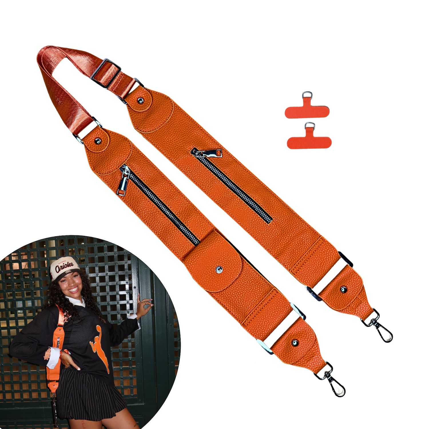Orange bag strap with clips on a white background