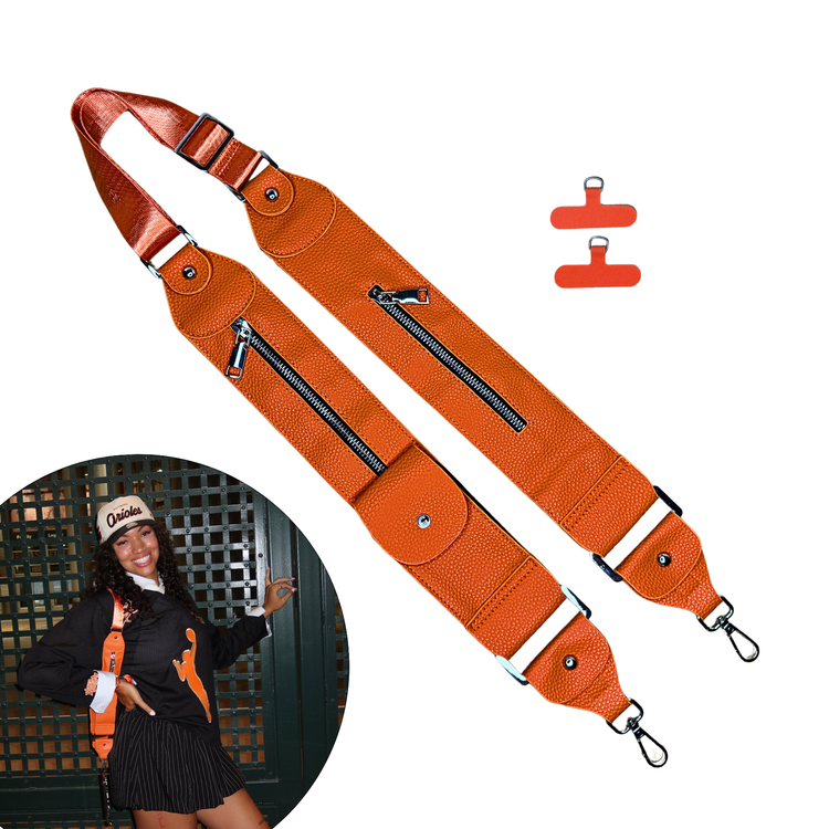Orange bag strap with clips on a white background