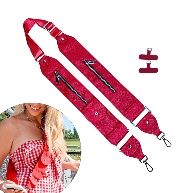 Red bag strap with zippers and clips on a white background