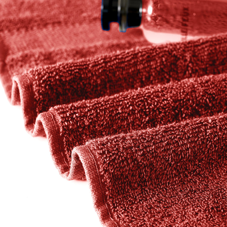 Close-up of red microfiber towels with a white background