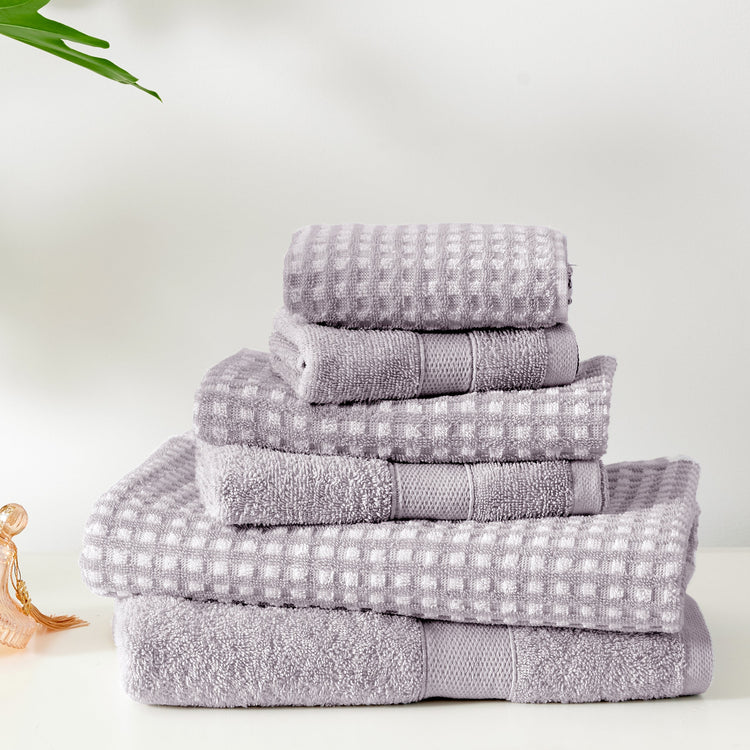 Stack of gray towels on a white background