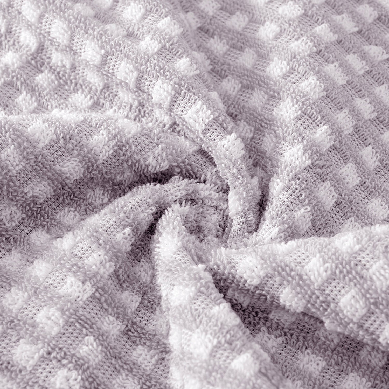 Close-up of textured gray fabric with a waffle pattern