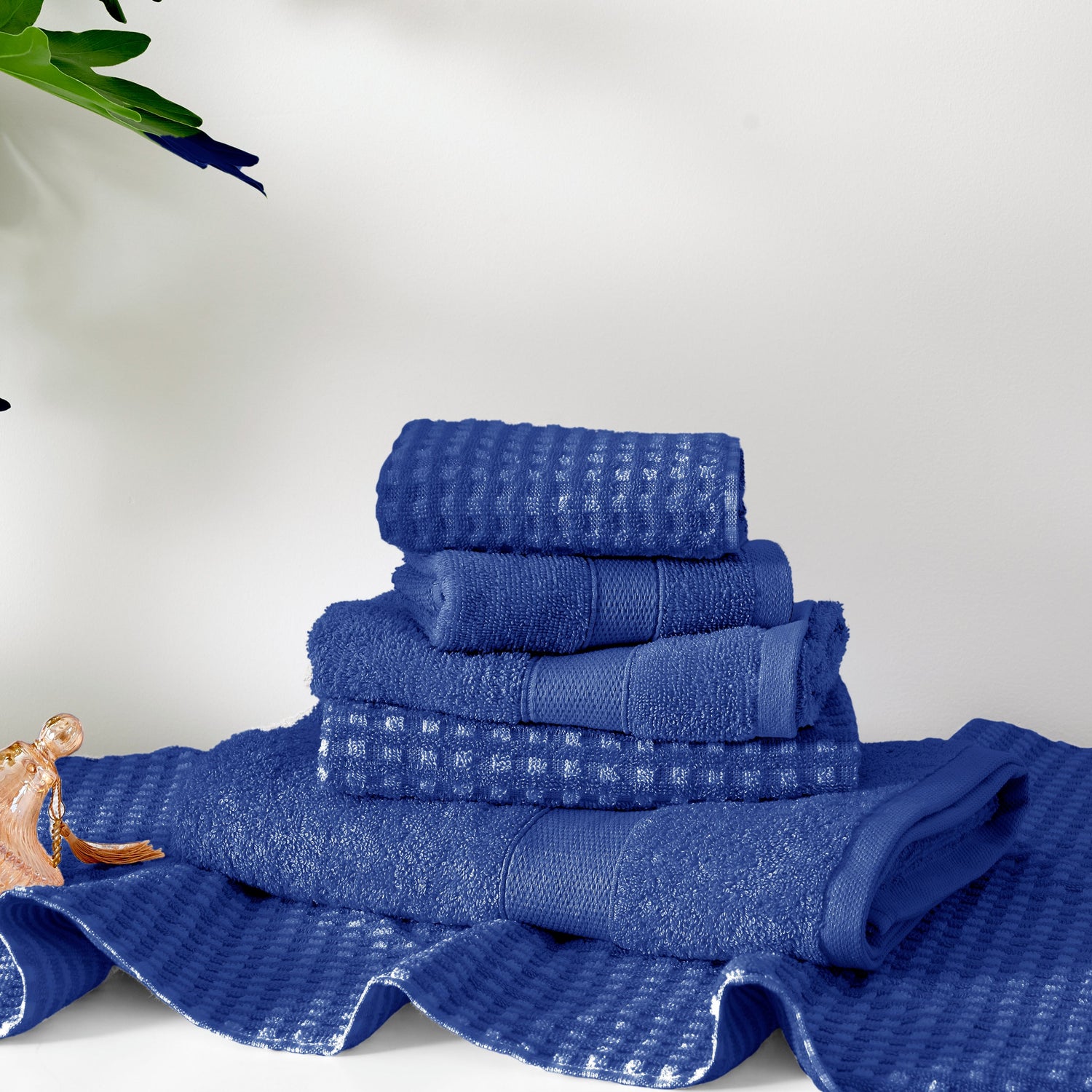 Stack of blue towels on a white background