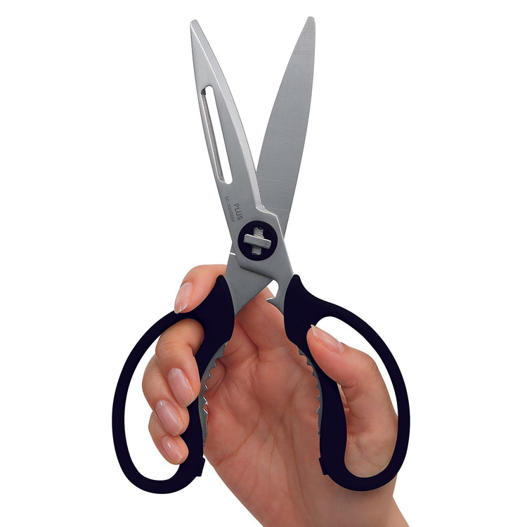 Hand holding a pair of scissors with black handles on a white background
