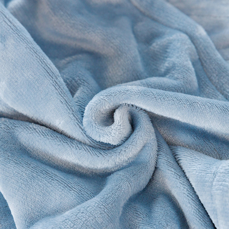 Close-up of textured blue fabric with a soft, plush appearance.