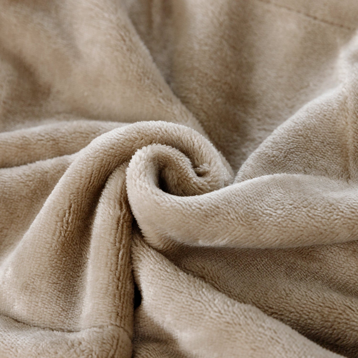 Close-up of beige fleece fabric with a soft texture