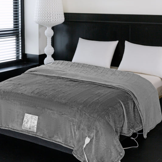 Gray electric blanket on a bed in a bedroom setting