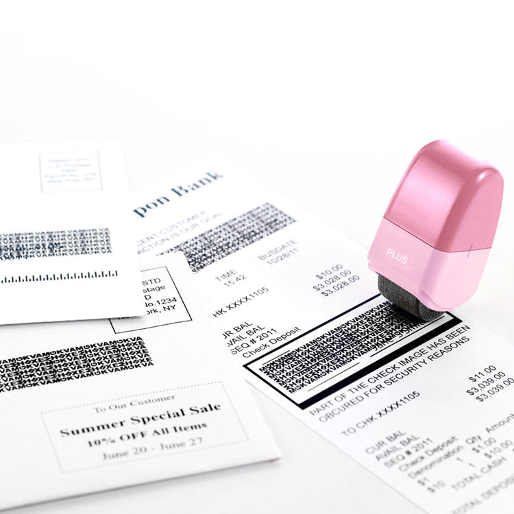 Pink stamp on a document with barcodes and text