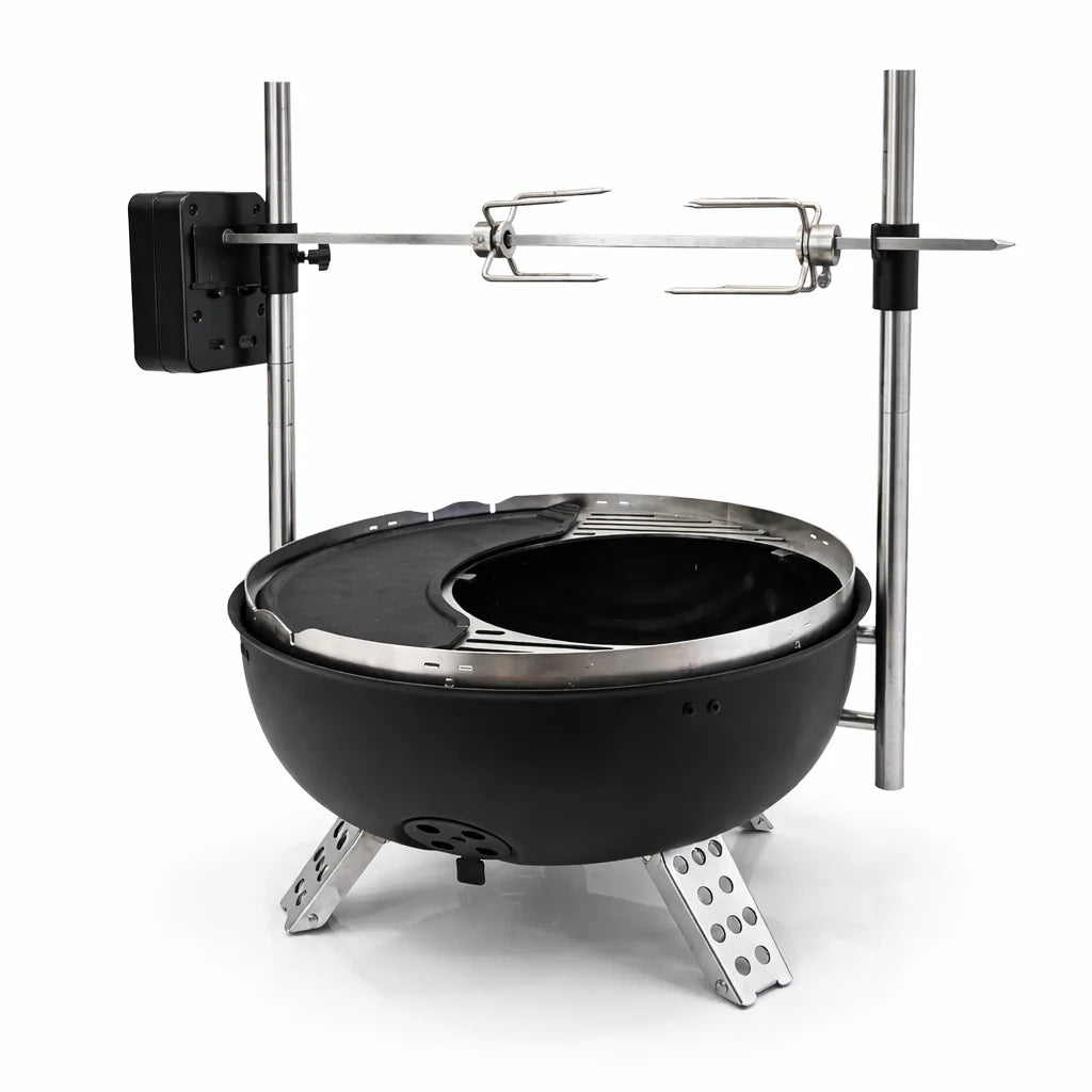 Black portable fire pit with metal stand and skewer on a white background