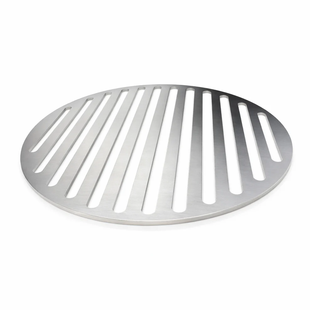 Round metal grill grate on a white background