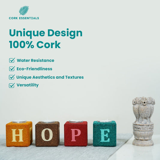 Colorful blocks spelling 'HOPE' with small candles on a white background