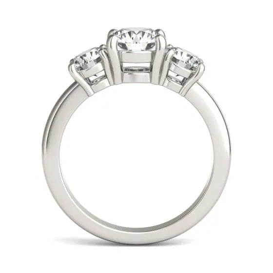 Silver ring with three diamondstones on a white background