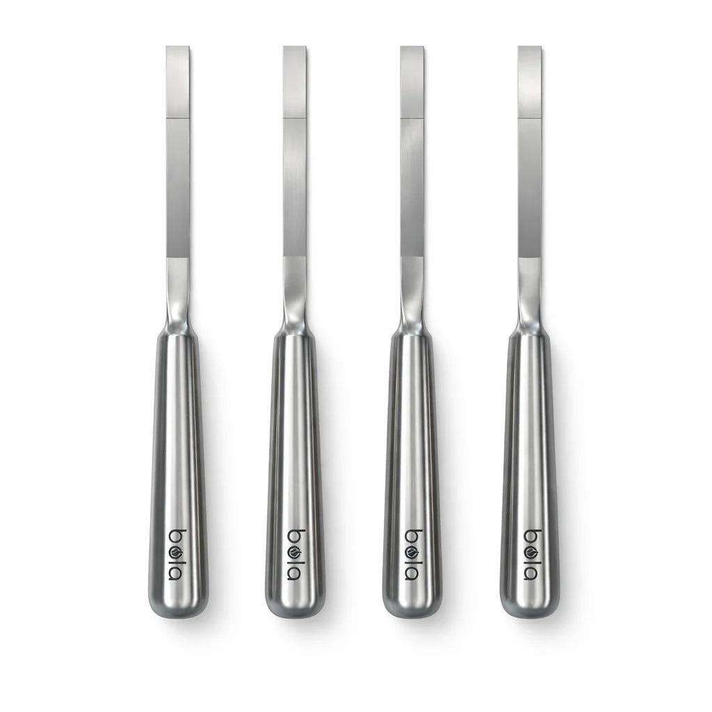 Four stainless steel knives with 'bela' branding on a white background
