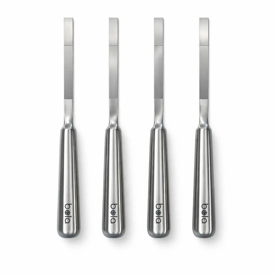 Black portable grill with metal skewers on a white background