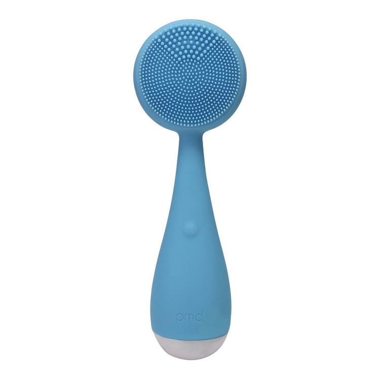 Blue silicone scrubber with bristles on a white background