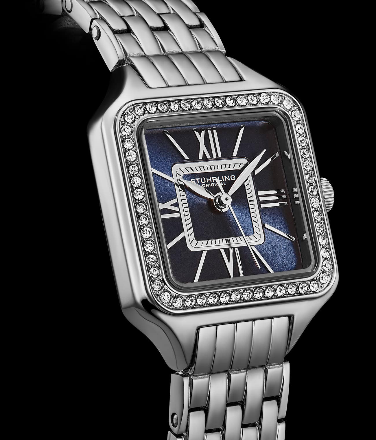 Silver watch with a blue face and diamond accents on a black background