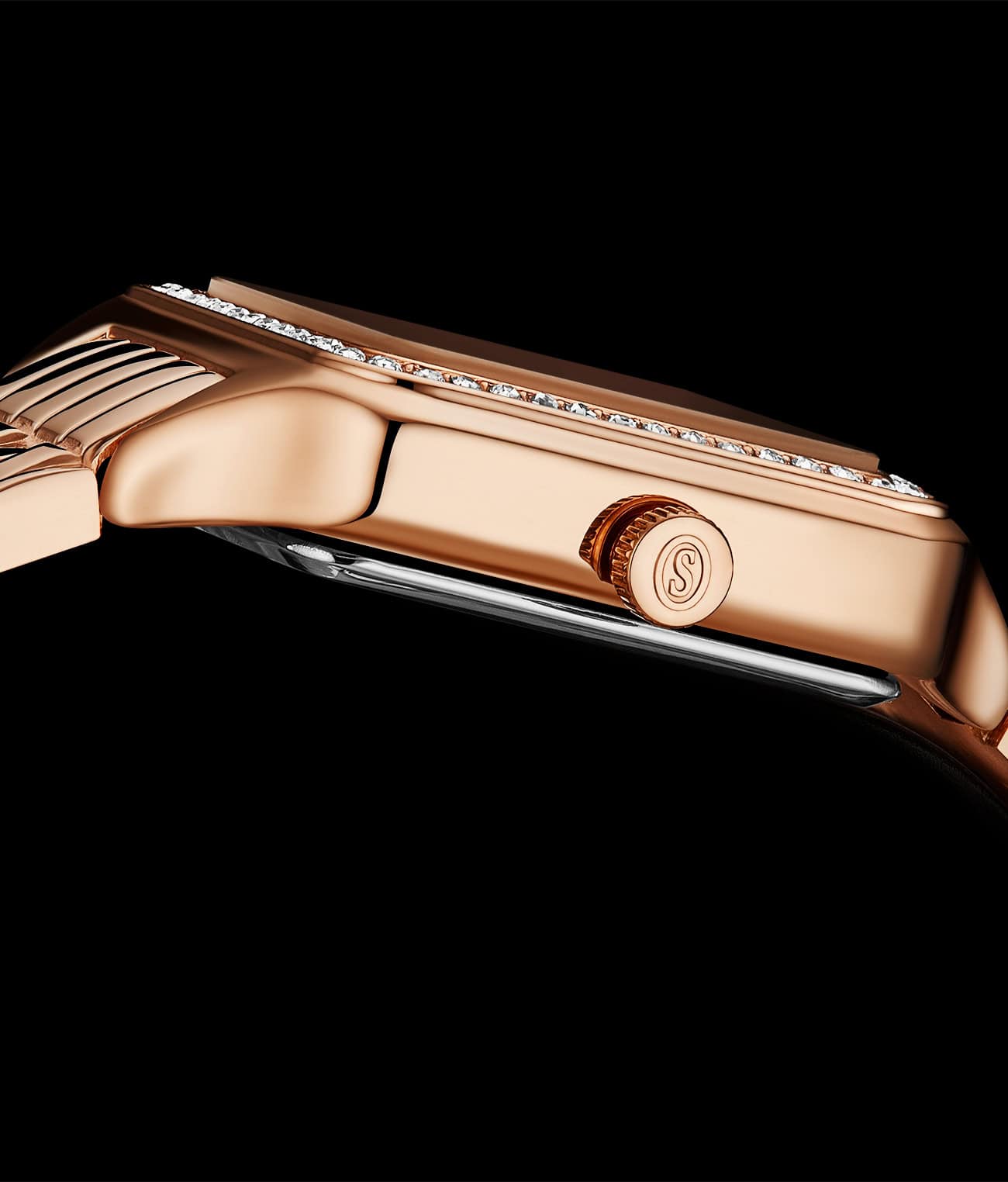 Rose gold watch with diamond accents on a black background