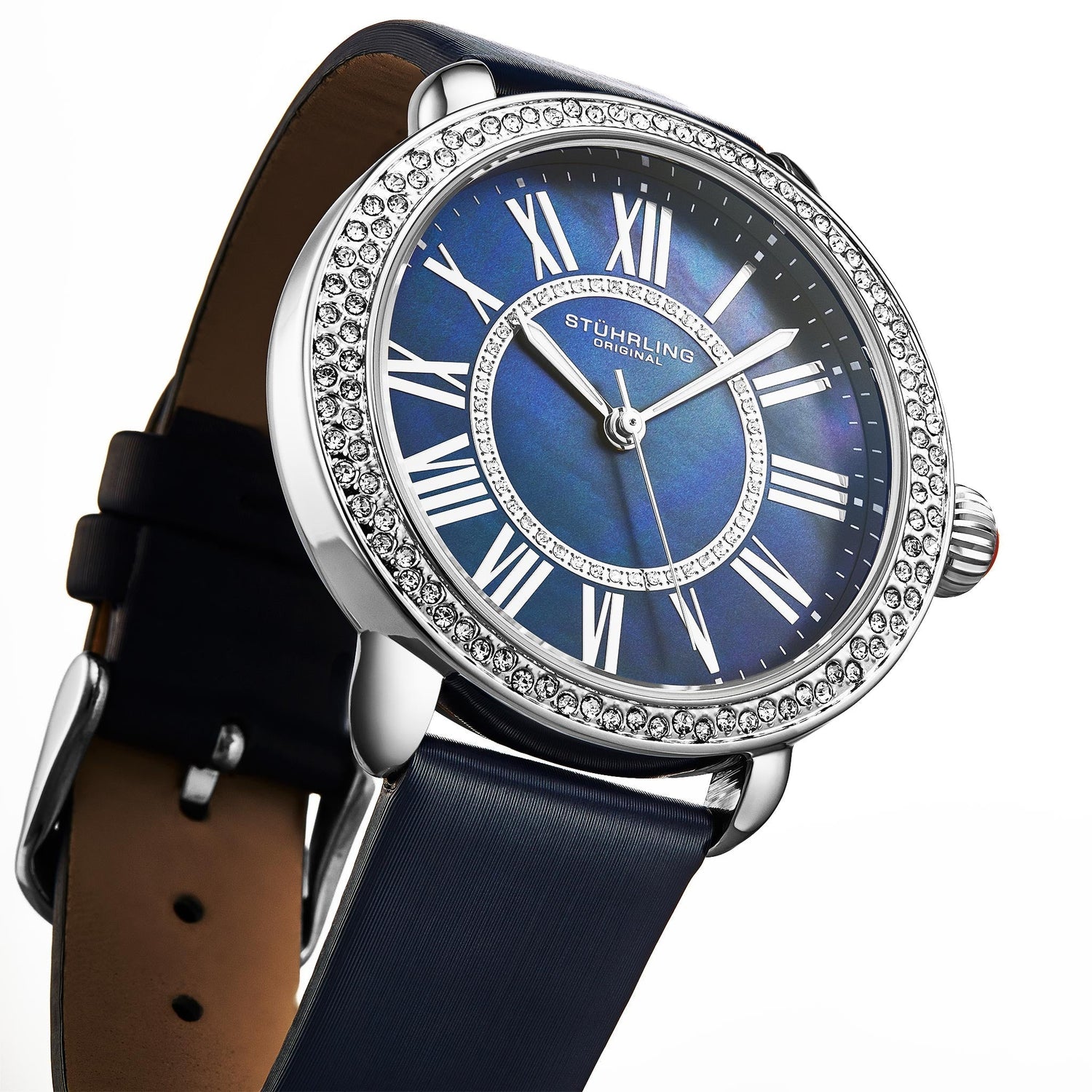 Luxury watch with blue face and black strap on white background