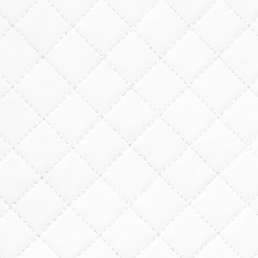 Mattress protector on a bed in a bedroom setting