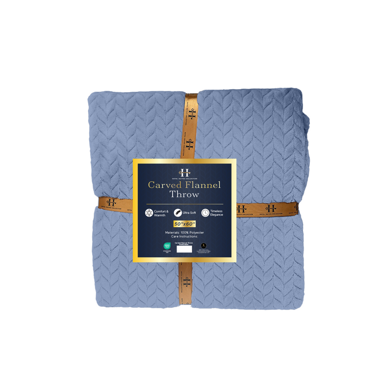 Folded blue flannel throw blanket with a brand label on a white background