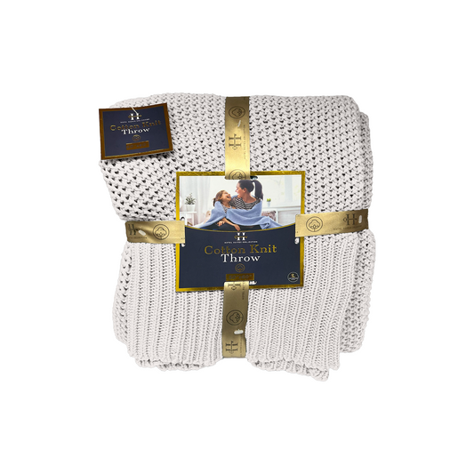 White knit throw blanket with packaging on a white background