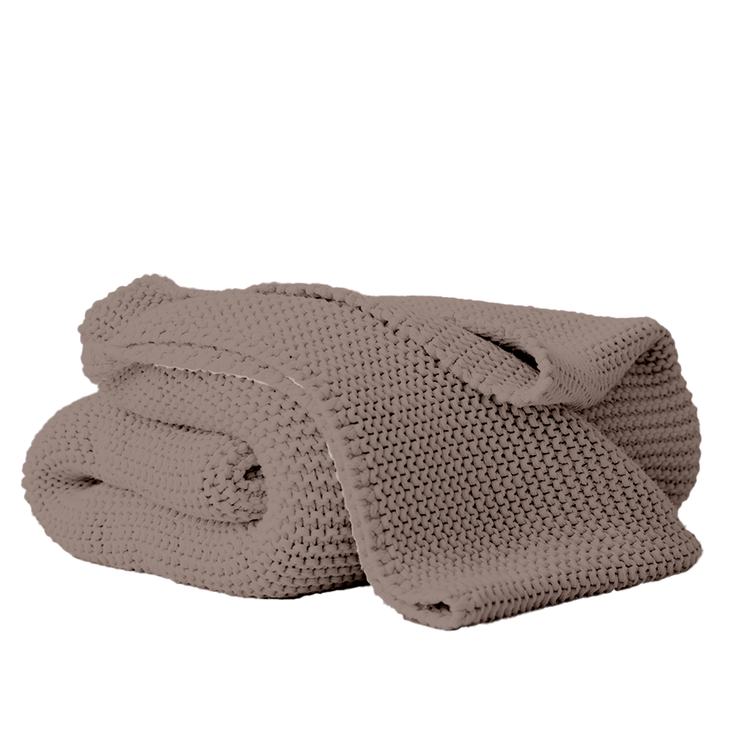 Folded brown blanket on a white background