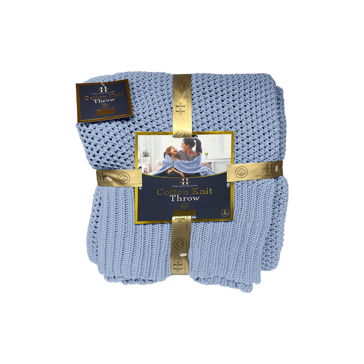 Blue knit throw blanket with packaging on a white background