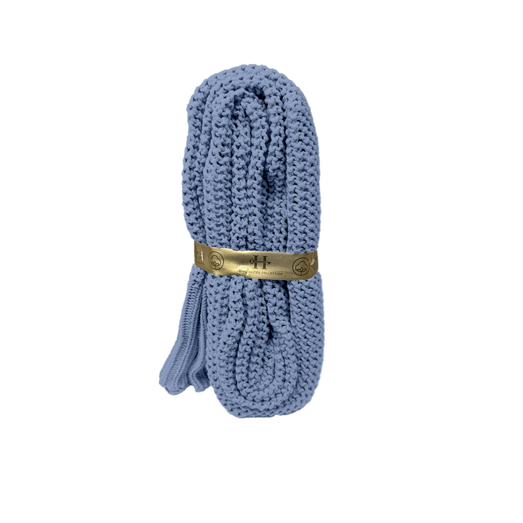 Blue shoelace with a gold label on a white background