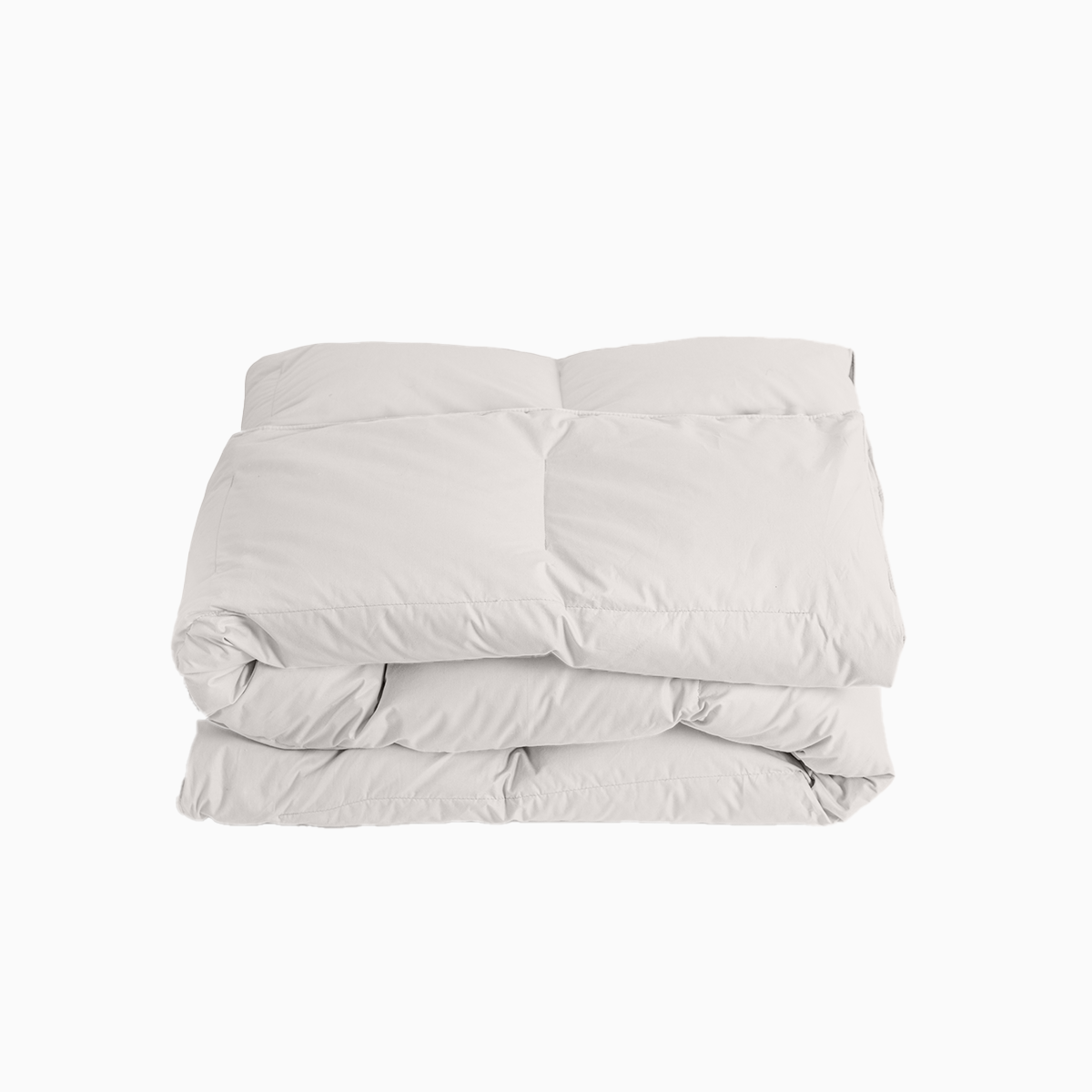 Folded light gray comforter on a white background