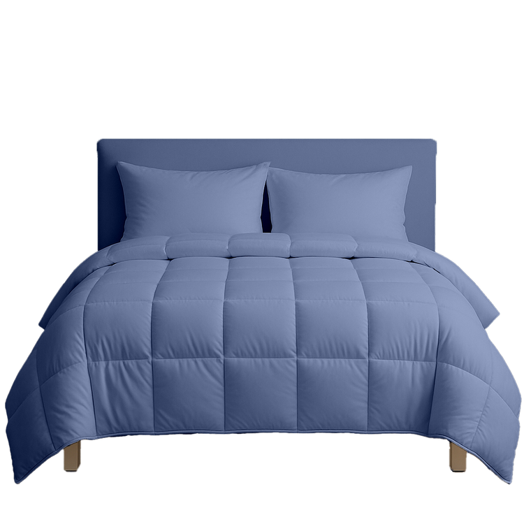 Blue comforter set on a bed with matching pillows against a white background