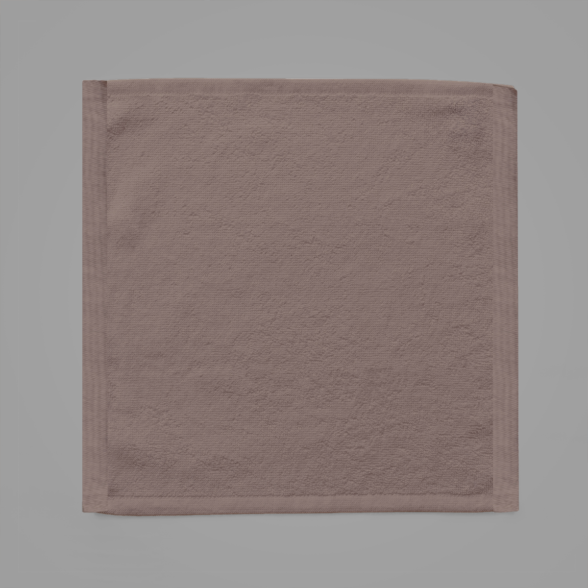 Brown towel on a gray background